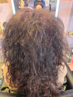 Before treatment – severely frizzy and damaged curly hair in salon, showing the problem RUTAM 360° PRO SHIELD is designed to restore