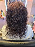 After RUTAM 360° PRO SHIELD treatment – curly hair restored with defined, bouncy curls and reduced frizz in salon setting, back view